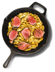 Penne Pasta with Roast Beef Slices in a Cast Iron Skillet Isolated