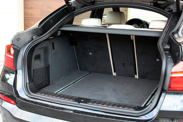 Modern wagon car open trunk. Car boot is open. Rear view of the car open trunk. The exterior of a modern, modern car empty trunk