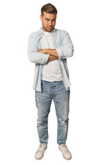 Fototapeta premium Full body portrait of a man in studio suspicious, uncertain, examining you.