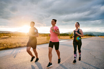 Athlete Leading Group Run at Sunset Amidst Stunning Nature