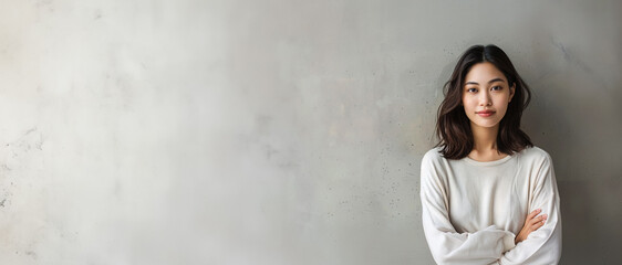 Beautiful East Asian woman is looking at viewer. A casually dressed Korean or Japanese girl. Large Copy Space on left. Illustration in realistic horizontal photographic style, Ultra Wide Screen ratio.