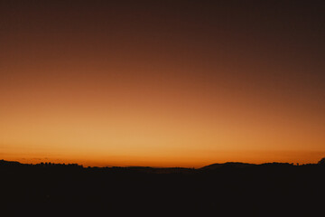landscape view of orange sunset in the countryside