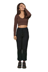 Middle Eastern woman, full body studio laughing happy, carefree, natural emotion.