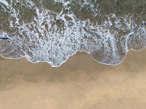 Beach shore wave background view from above