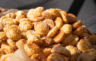 Puff pastries, round sugar-coated sugar puffs, golden crispy baked sweets, traditional French...
