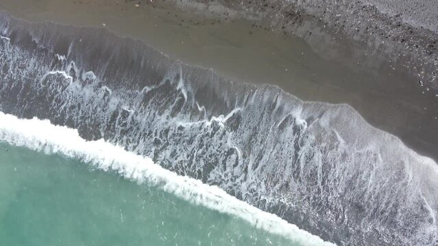 Waves crashing on the shore.