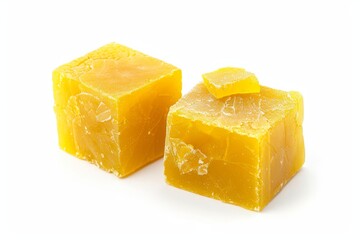 Two yellow bouillon cubes isolated on white background two angles