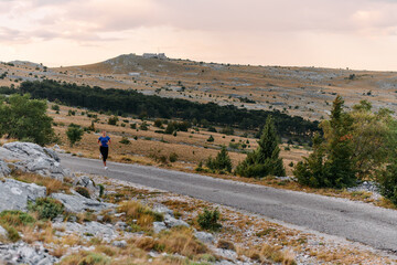 Empowered Runner Embracing Nature's Beauty on a Serene Morning Trail.