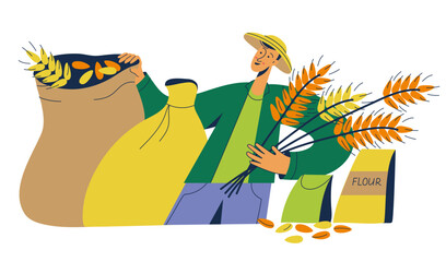 Young farmer holding a bunch of ears of wheat and bags with grains and flour. Agriculture, organic farm food