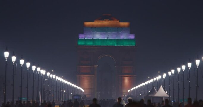 New Delhi, India. People walking near India Gate Or All India War Memorial In Evening Night Time. Statue Of Subhas Chandra Bose Or Netajis Statue On Background. National Hero
