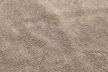 Dry soft brown towel as background, closeup