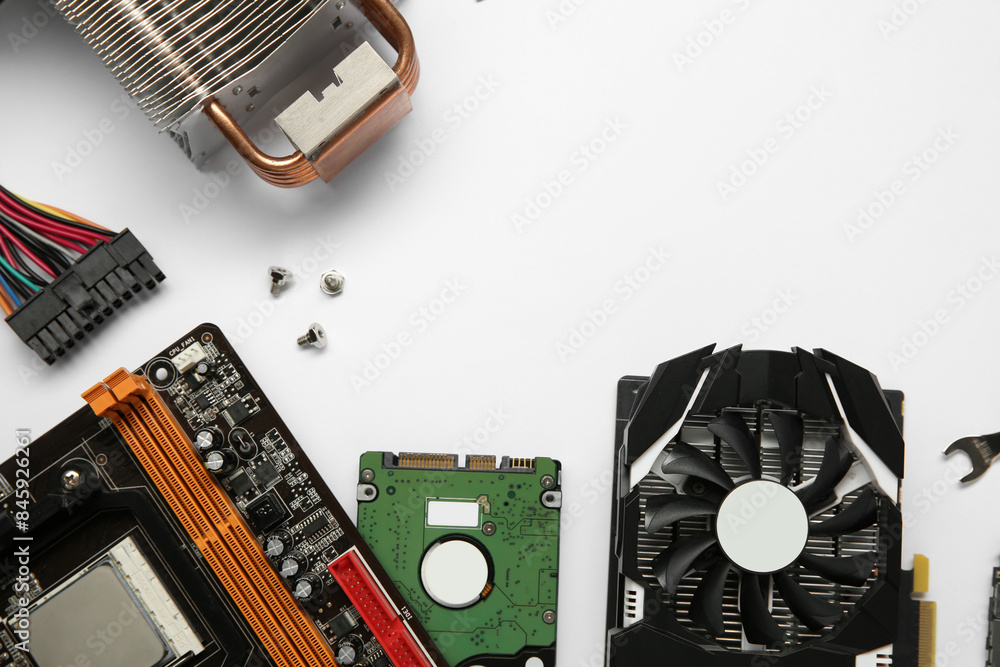 Poster graphics card and other computer hardware on white background, flat lay. space for text