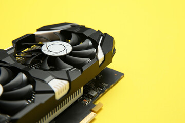 Computer graphics card on yellow background, closeup. Space for text