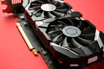 Computer graphics card on red background, closeup