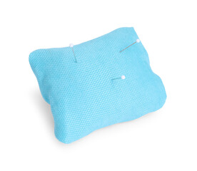 Light blue pincushion with sewing pins isolated on white