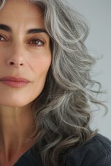 Naklejka premium This portrait shows an older woman with impeccable skin care and makeup.
