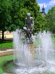 Fountain with sculpture in the central park in summer, Pilsen, Czech Republic