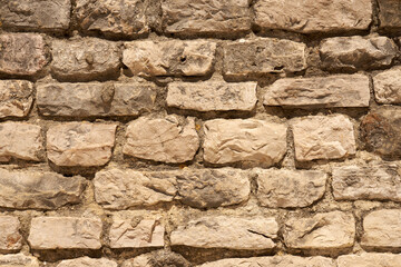 A wall of stones on mortar as a background.