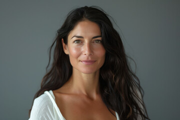 Fototapeta premium A close up portrait of a woman with a subtle smile