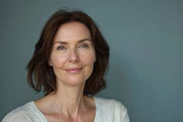 A close up portrait of a woman with a subtle smile