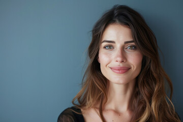 Fototapeta premium A close up portrait of a woman with a subtle smile