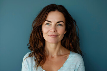 A close up portrait of a woman with a subtle smile