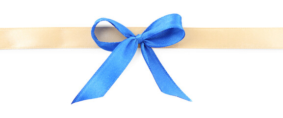 Fototapeta premium Golden satin ribbon with blue bow isolated on white, top view