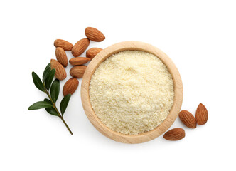 Fresh almond flour in bowl, branch with leaves and nuts isolated on white, top view