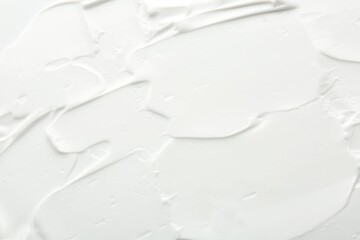 Texture of face care cream as background, top view