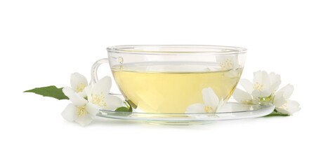 Aromatic herbal tea in glass cup and flowers isolated on white