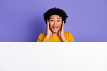 Photo of cheerful excited man wear trendy yellow clothes wow information empty space isolated on...