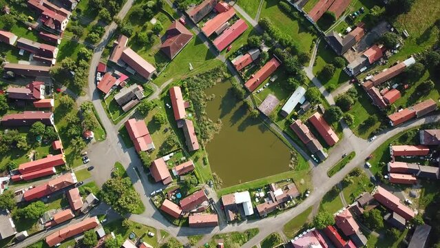 Top down view of beautiful village in summer countryside. Circular shape traditional village Lipnice in Brdy, Czech republic, Europe. Drone camera flying over beautiful landscape.