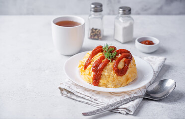 Omurice with ketchup sauce in a plate