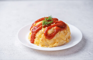 Omurice with ketchup sauce in a plate