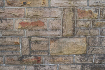 Old masonry made of natural stone. Ancient medieval wall