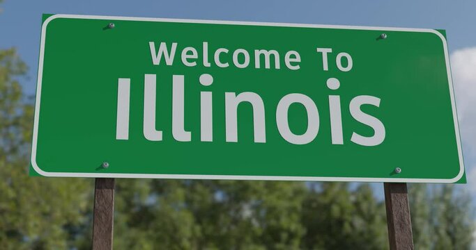 Driving By A Welcome To Illinois Green Road Sign Against a Blue Sky and Clouds.


