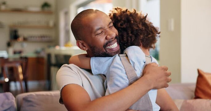 Smile, hugging and dad with child on sofa relaxing in living room for fathers day celebration. Happy, love and boy kid embracing black man on couch in lounge for bonding together at family home.