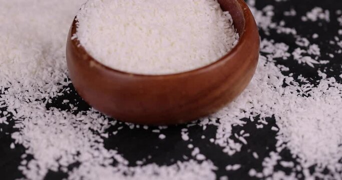dry white coconut chips for adding to desserts, finely chopped coconut pulp dried in sugar syrup