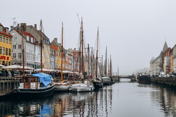 Fototapeta premium Copenhagen, Denmark - March 13, 2024: Historical center of Copenhagen on a cloudy day