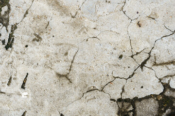 Cracked and weathered concrete surface texture background.