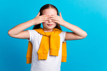 Photo of sweet lovely small girl wear tied pullover arms close eyes empty space isolated blue color...