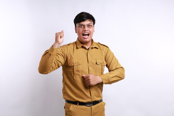 Enthusiastic Indonesian government employees standing with clenched hand. Isolated on white