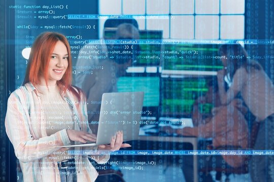 Female programmer working with laptop in office