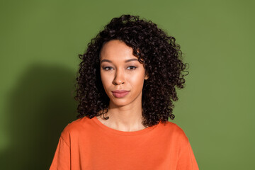 Photo portrait of attractive young woman look camera smile dressed stylish orange clothes isolated on khaki color background