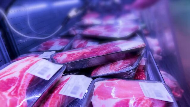 Fresh Pork Steak Portions: Chilled Meat Display at Grocery Supermarket - Buy High-Quality Raw Protein for Delicious Meals