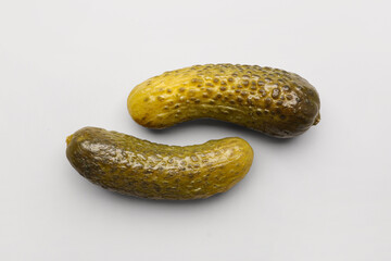 Pickled cucumbers on grey background