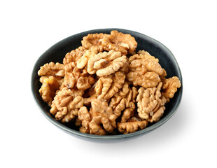 Bowl of tasty walnuts on white background