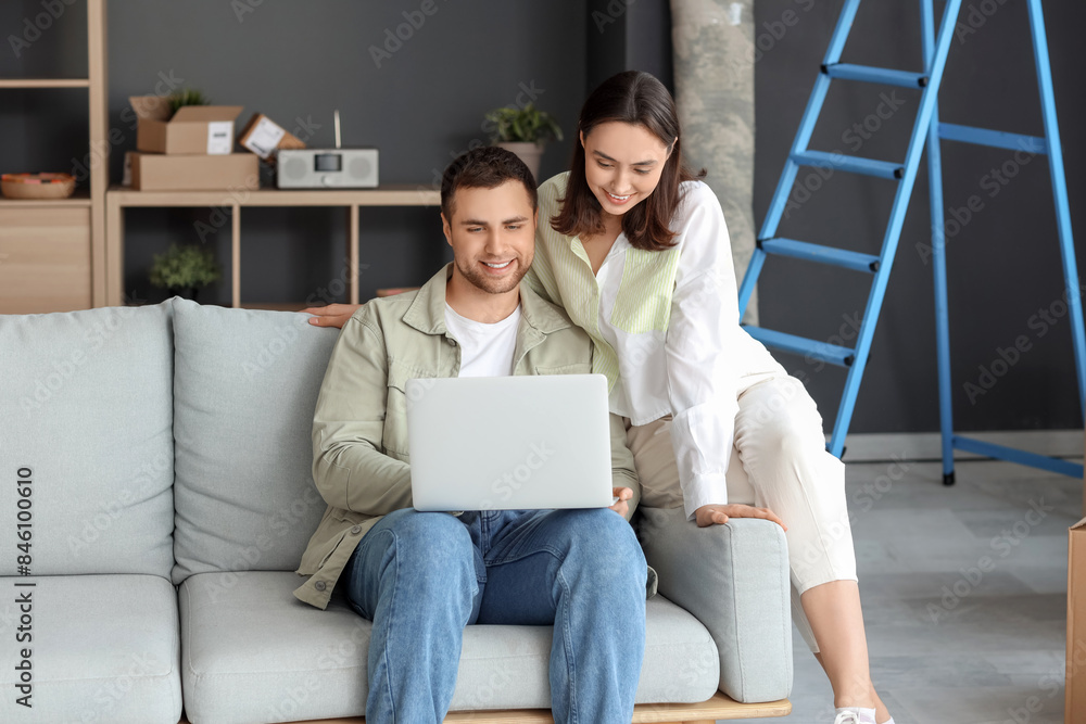 Sticker young couple using laptop in room on moving day