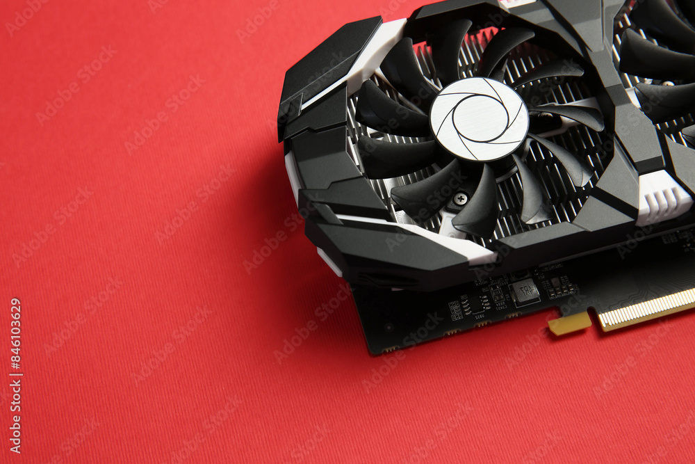 Fototapete computer graphics card on red background, above view. space for text