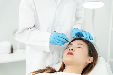 Naklejka premium plastic surgery, beauty, Surgeon or beautician touching woman face, surgical procedure that involve altering shape of nose, doctor injection to prepare for rhinoplasty, medical assistance, health